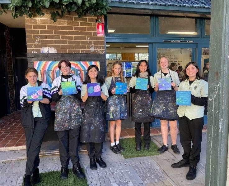 7 stduent shwoing theirArtwork which was completed during a CAPA workshop